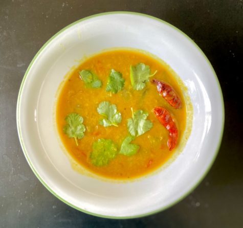 Sambar is a curry which is made from a tamarind-based broth, lentils, and vegetables.