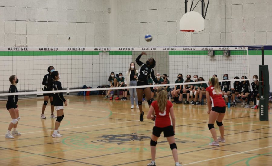 Clague 7th and 8th grade girls volleyball team spiking the ball during the match against Forsythe on March 10, 2022.