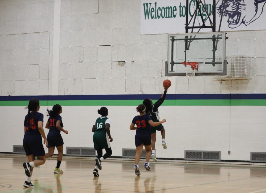 8th grader Chelsea Chinemelu doing a layup during a match against Scarlett on December 15, 2022 at Clague Middle School. 