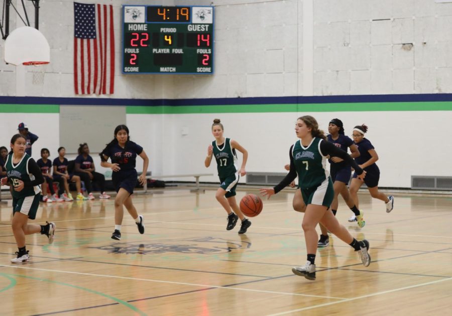 8th grader Ayla Robbins dribbling the ball during a match against Scarlett on December 15, 2022 at Clague Middle School. 