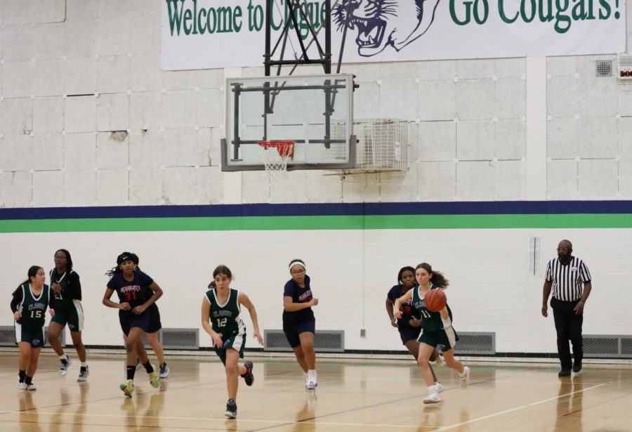 8th grade girls basketball team during a match against Scarlett on December 15, 2022 at Clague Middle School. 