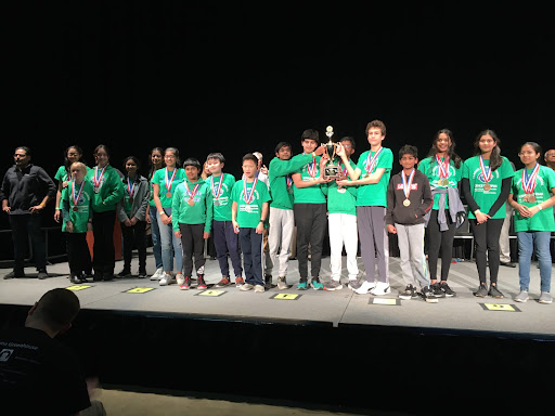 The Clague Science Olympiad team holding up a trophy. 