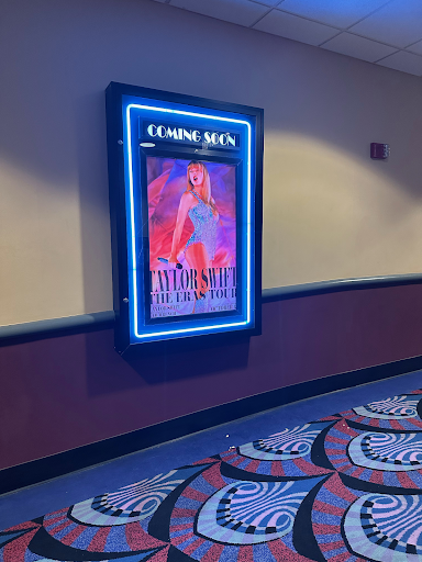 Taylor Swift: The Eras Tour movie board at theaters. The movie, released on Oct. 13, is estimated to have made $129.8 million at the domestic box office.