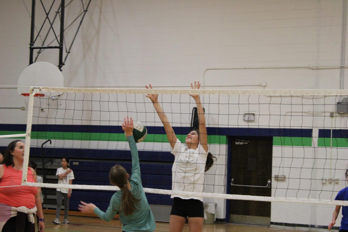Going up for the block is 8th grader Julia Gamboa.