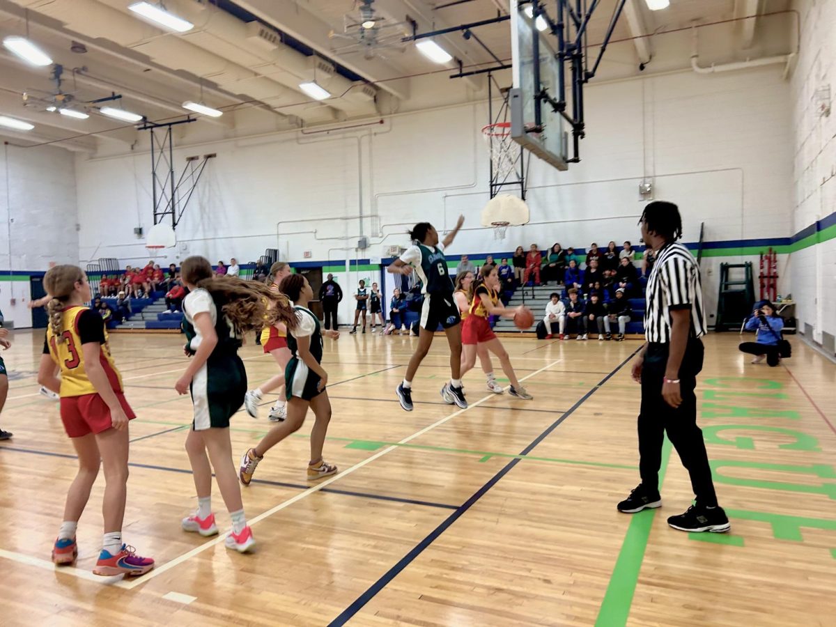 Seventh grader Amorra Bailey defending the basket from Slauson.
