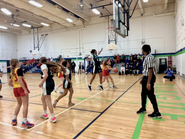 Seventh grader Amorra Bailey defending the basket from Slauson.
