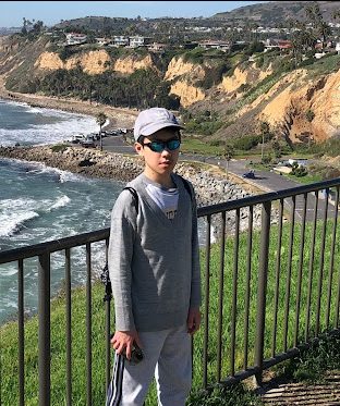 Clague seventh grader, Lucas Ha, posing for a photo at White Point Beach.