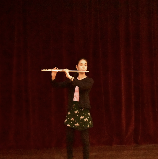 Seventh grade flute player Annamaria Riccardi performing Carnival of Venice during International Night.
