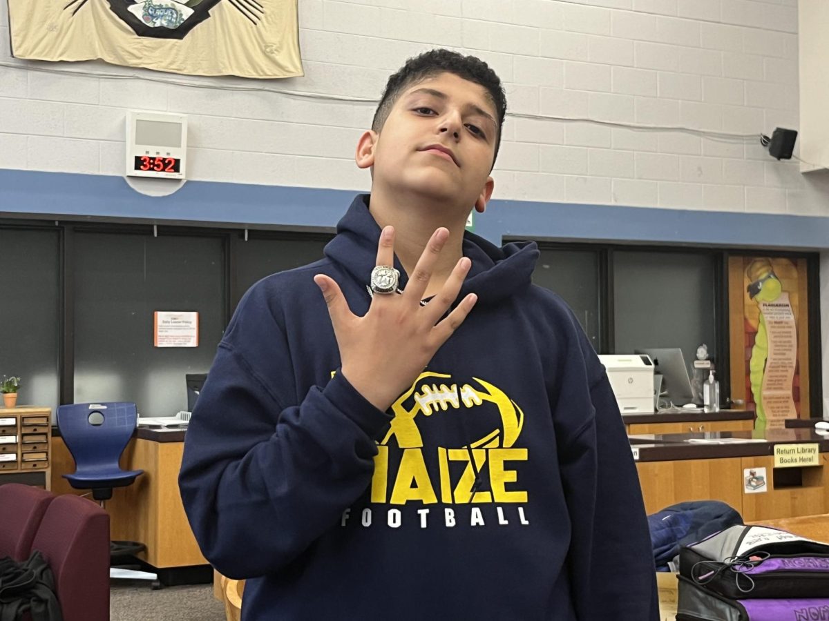 Omar Dari is a seventh grader at Clague that enjoys playing football for the maize team.