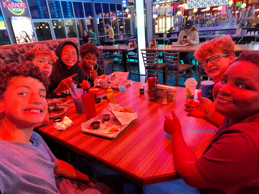 Gabe, Jackson, Wyat, Taveon, Francis  and Ethan eating food after playing basketball. The fundraiser was from 9-12 at Best in Games in Ypsilanti.