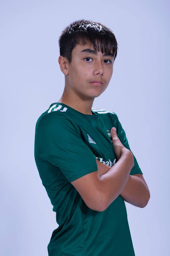 Alex in his soccer uniform for team pictures.