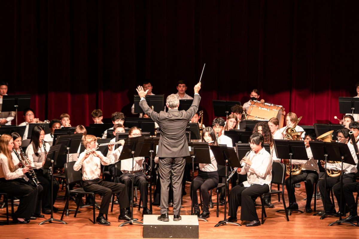Jay MacArthur leads the band in the performance on Tuesday Nov. 11. The concert was held at Clague Middle School.
