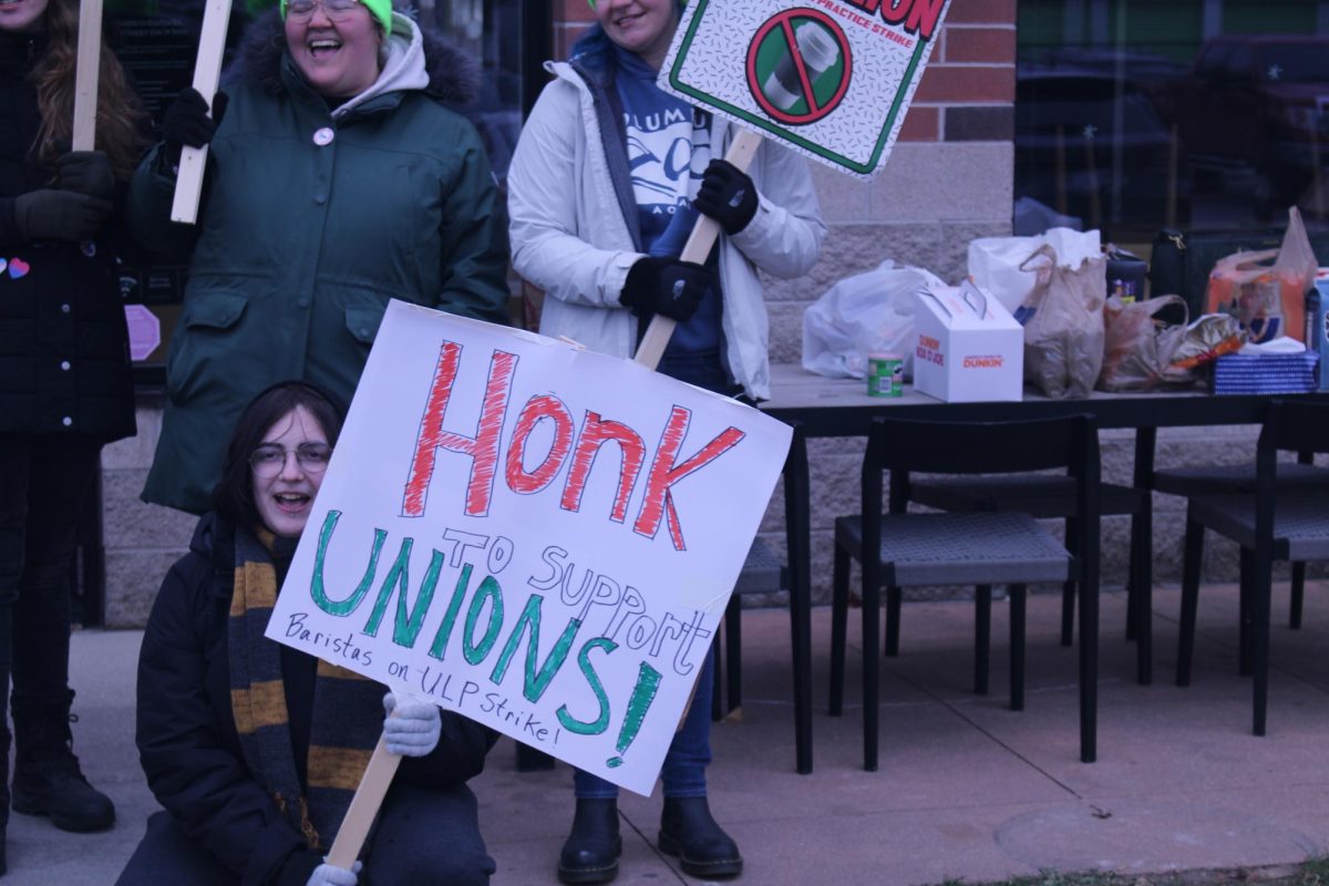 Starbucks employees and people supporting them stand outside of the Starbucks store located on Carpenter Road in Ypsilanti with signs. The built up frustration at the Starbucks CEO is about an Unfair Labor Practice (ULP) they filed.