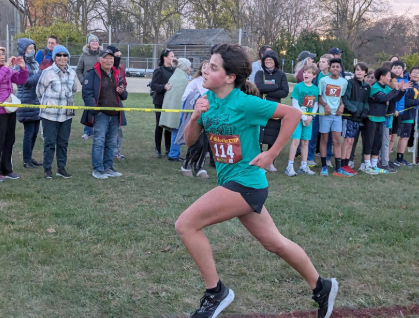 Seventh Nadia Stauder Lopez running towards the finish line. Photo courtesy of Lopez. 