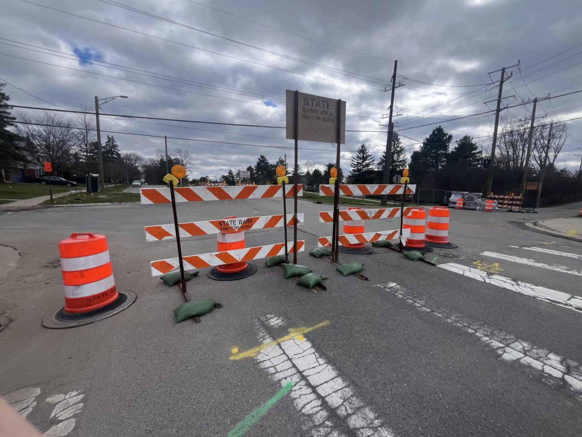 The construction on the road creates the new traffic pattern to enter and exit Clague Middle School.