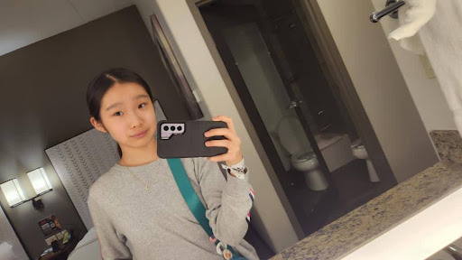 Joyce Kim taking a selfie in front of a mirror. Photo courtesy of Joyce Kim.