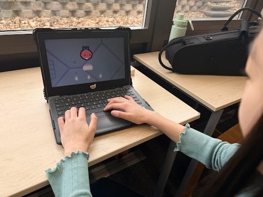Seventh grader, Lea Park playing Dadish on her computer.
