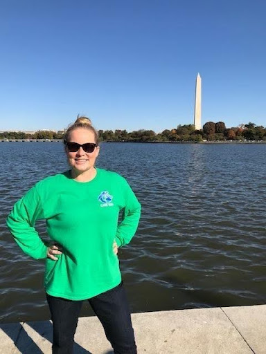 Meredith Pelchat is a math teacher at Clague Middle School. She is posing for a photo in Washington DC. Photo Meredith Pelchat.