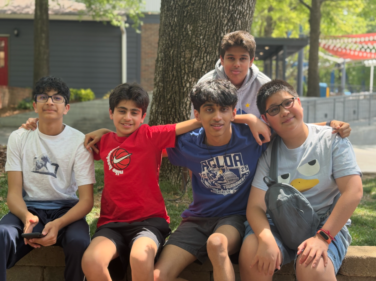 Eighth graders Ishaan Wasnik, Vihaan Sharma, Siddharth Sivaramakrishnan, Rohit Giddu, and Shuhao Dong pose for the picture during a stop on the way to the nationals tournament.