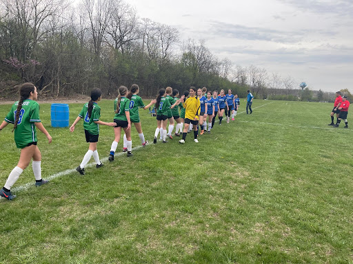 Clague players and Tappan players exhibit good sportsmanship after the game by congratulating the opposing team.
Photo courtesy of (Coach) Tom Oatley
