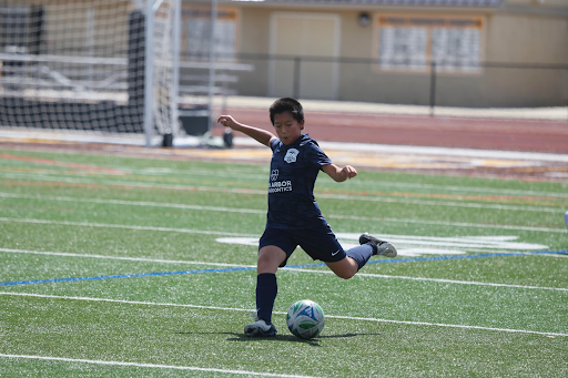 Seventh grader Shaun Zhu about to kick a soccer ball. Photo courtesy of Zhu